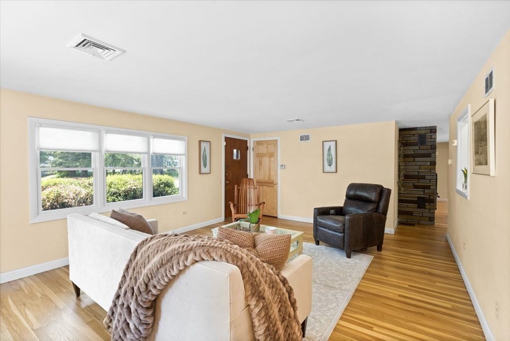 280 Broadway Hanover, MA 02339 - Photo 22 of 37 a spacious bedroom with a bed and wooden floor