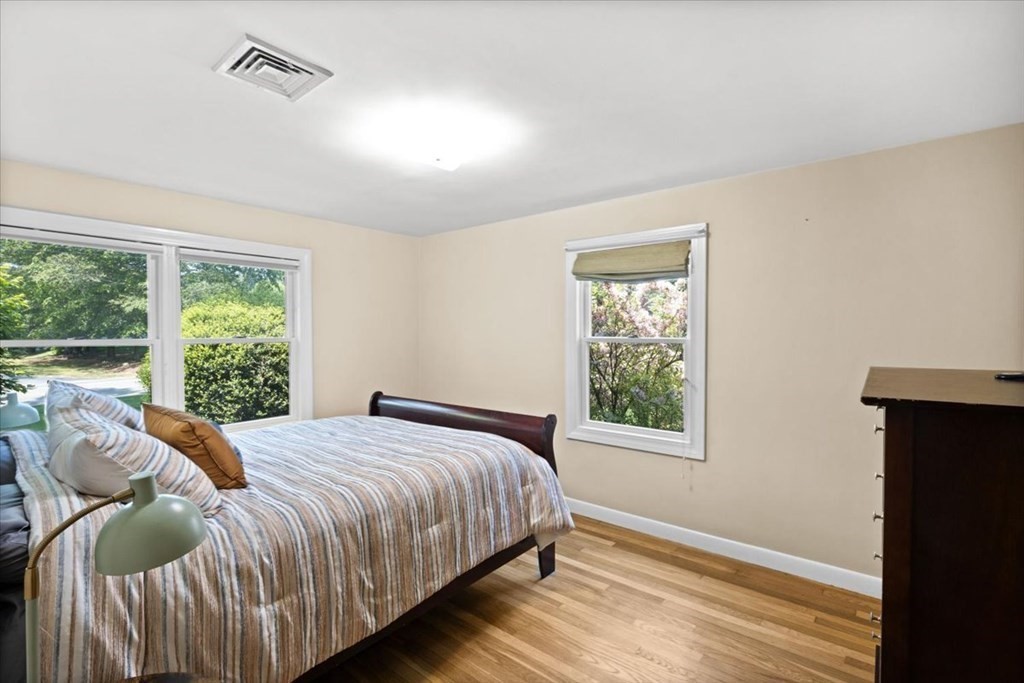 280 Broadway Hanover, MA 02339 - Photo 31 of 37 a large bed sitting in a bedroom next to a window