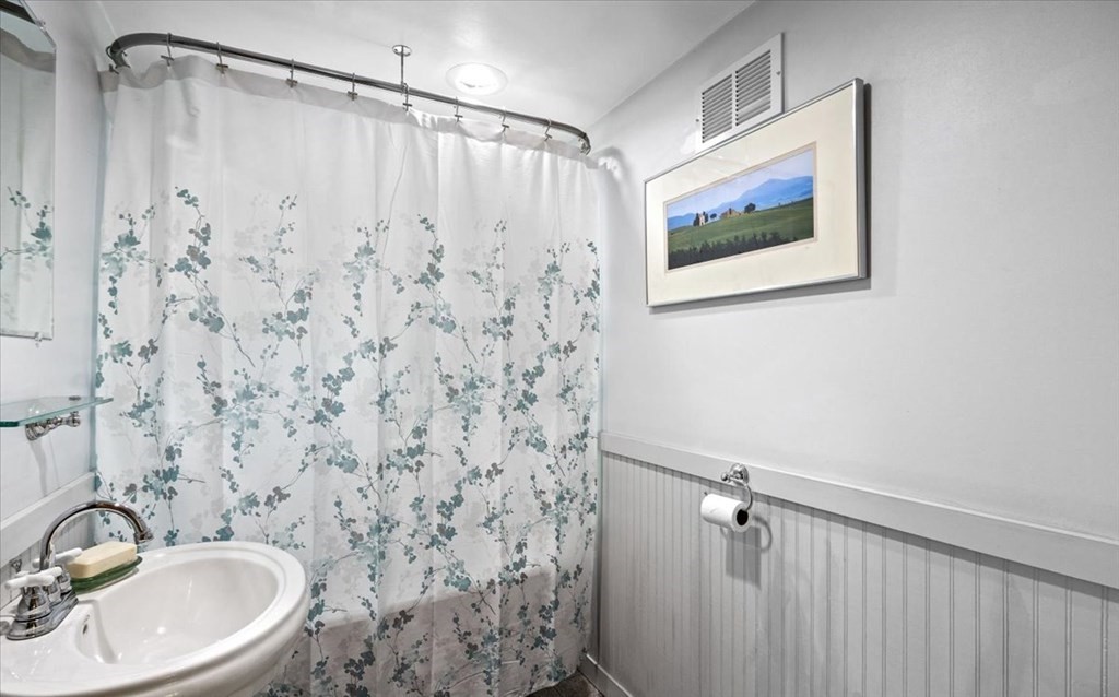 280 Broadway Hanover, MA 02339 - Photo 35 of 37 a bathroom with a sink and a mirror