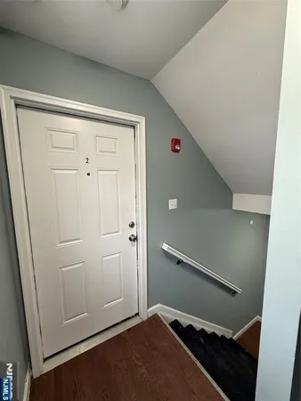 a view of an empty room and staircase