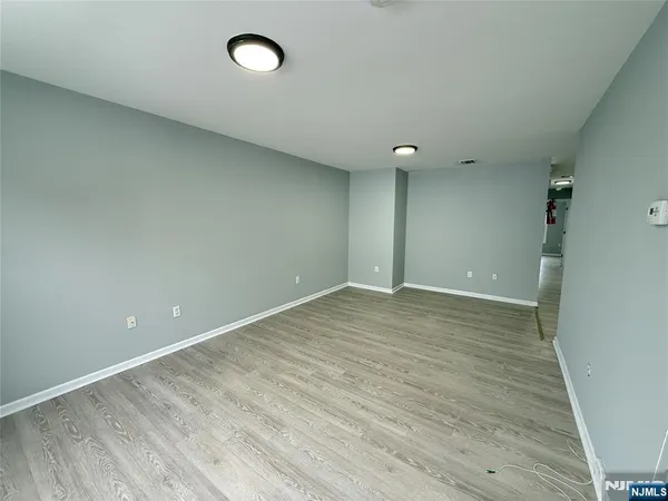 a view of a livingroom with wooden floor