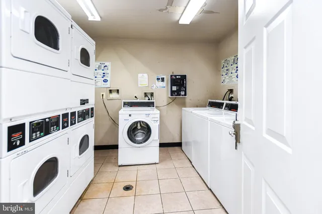 a utility room with dryer washer and a sink