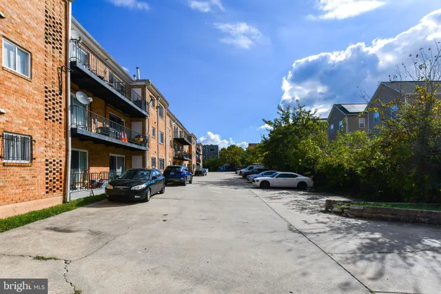 a view of a car park in front of building