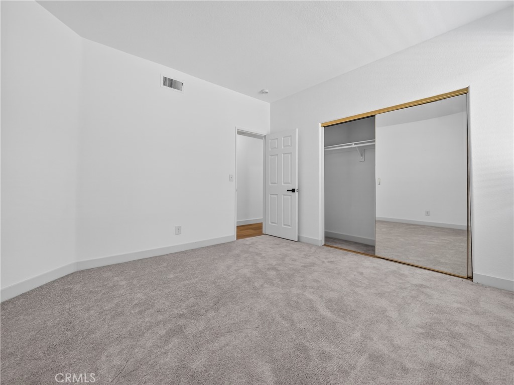 1436 Riviera Avenue Banning, CA 92220 - Photo 34 of 43 an empty room with an entryway