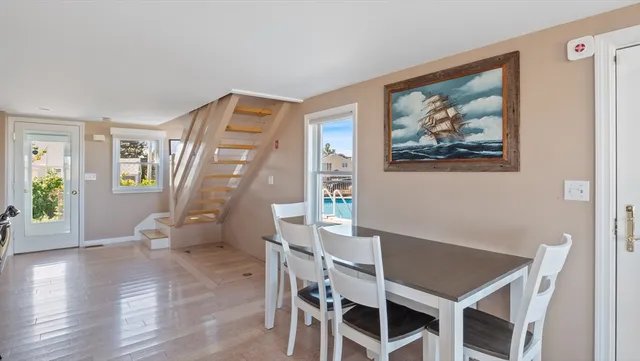 a view of a livingroom with furniture and stairs