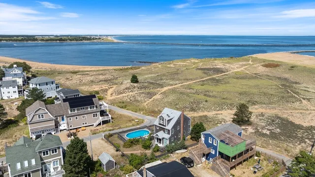 a view of an ocean with a building in the background