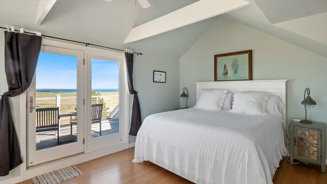 a bedroom with a large bed and a window