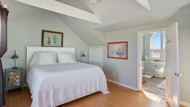 a bedroom with a bed and a view of bathroom