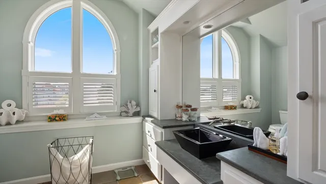 a kitchen with a sink a stove and a refrigerator