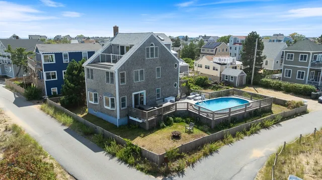 a aerial view of a house with a yard