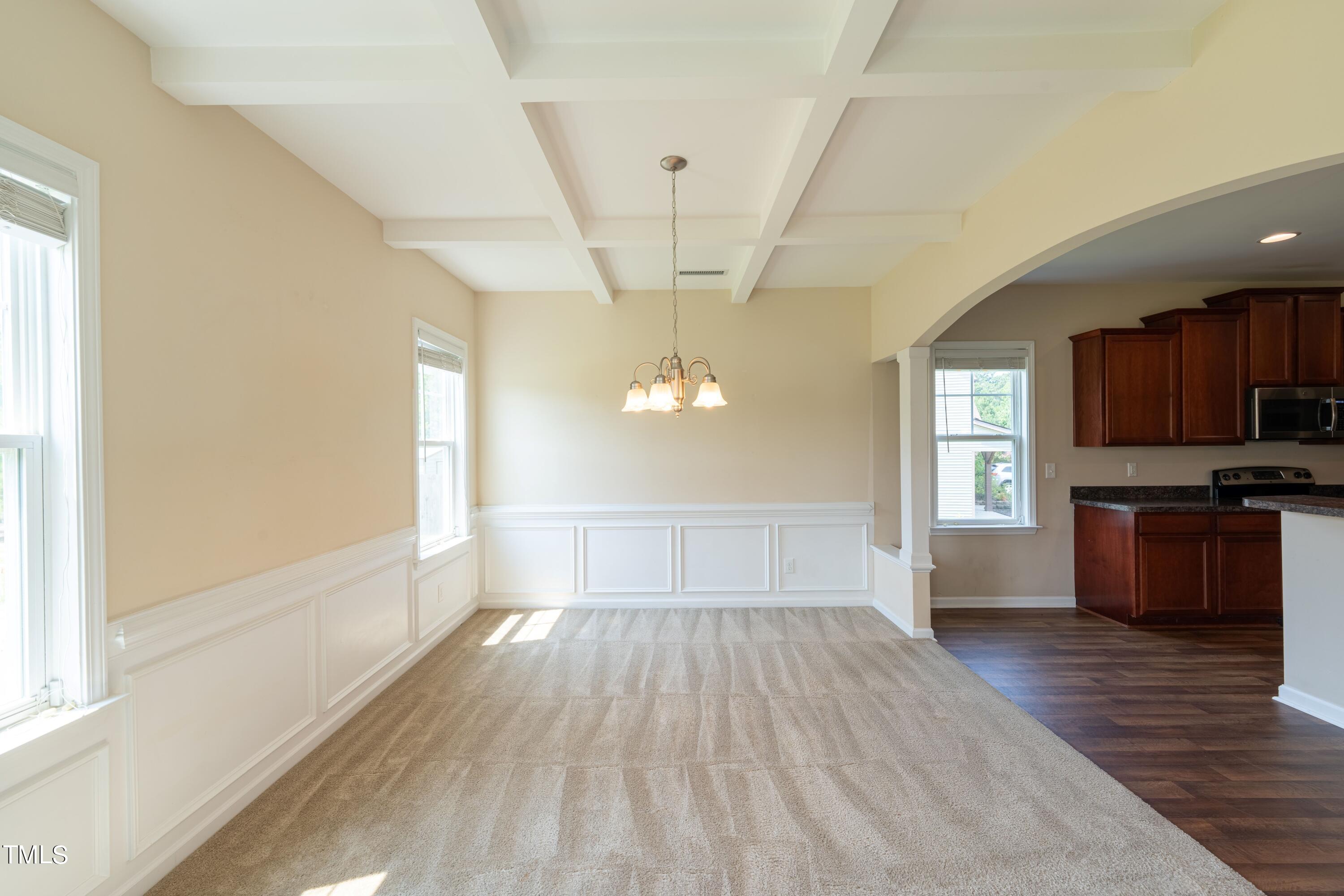 15 Lancaster Court Spring Lake, NC 28390 - Photo 26 of 48 a view of a kitchen and an empty room with wooden floor and a window