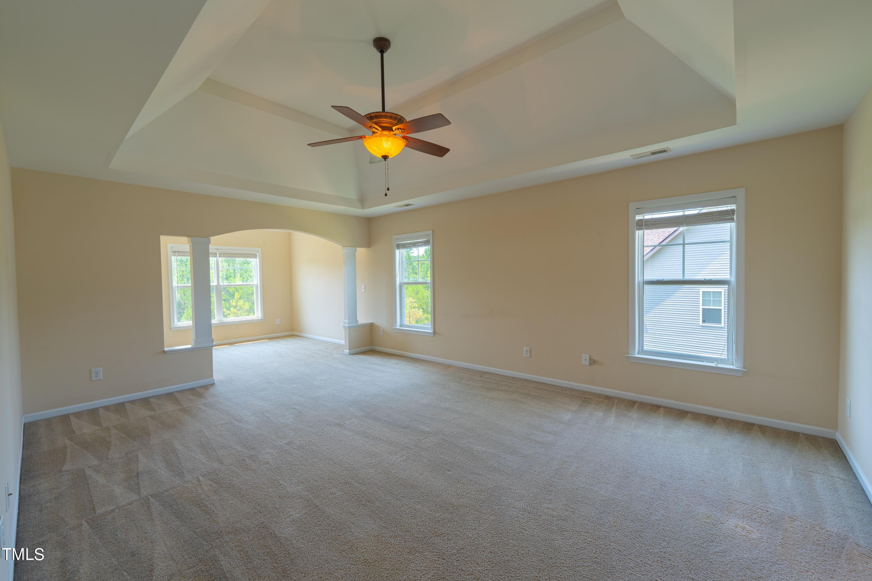 15 Lancaster Court Spring Lake, NC 28390 - Photo 32 of 48 an empty room with windows and ceiling fan