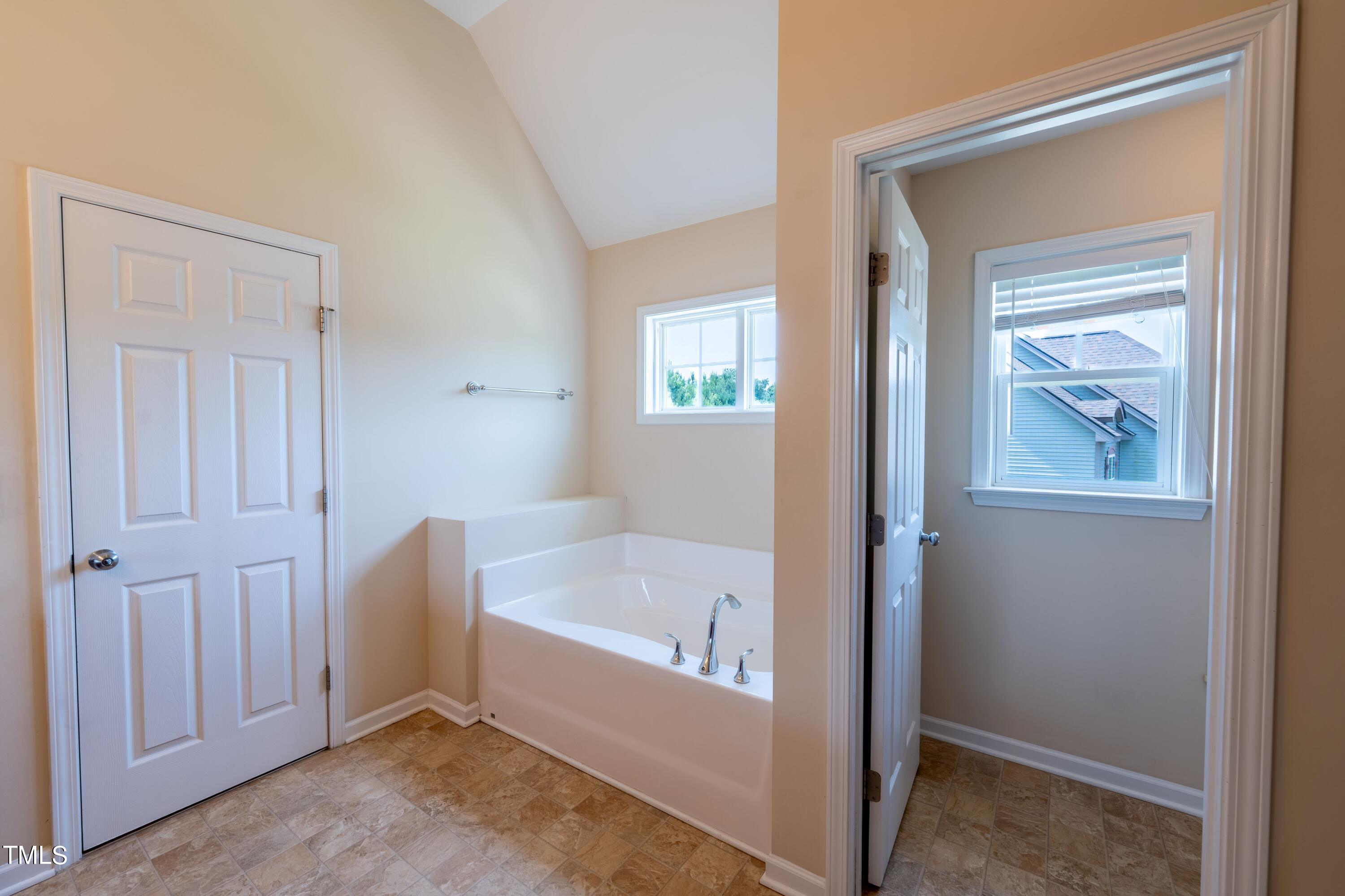 15 Lancaster Court Spring Lake, NC 28390 - Photo 36 of 48 a bathroom with a tub and a window