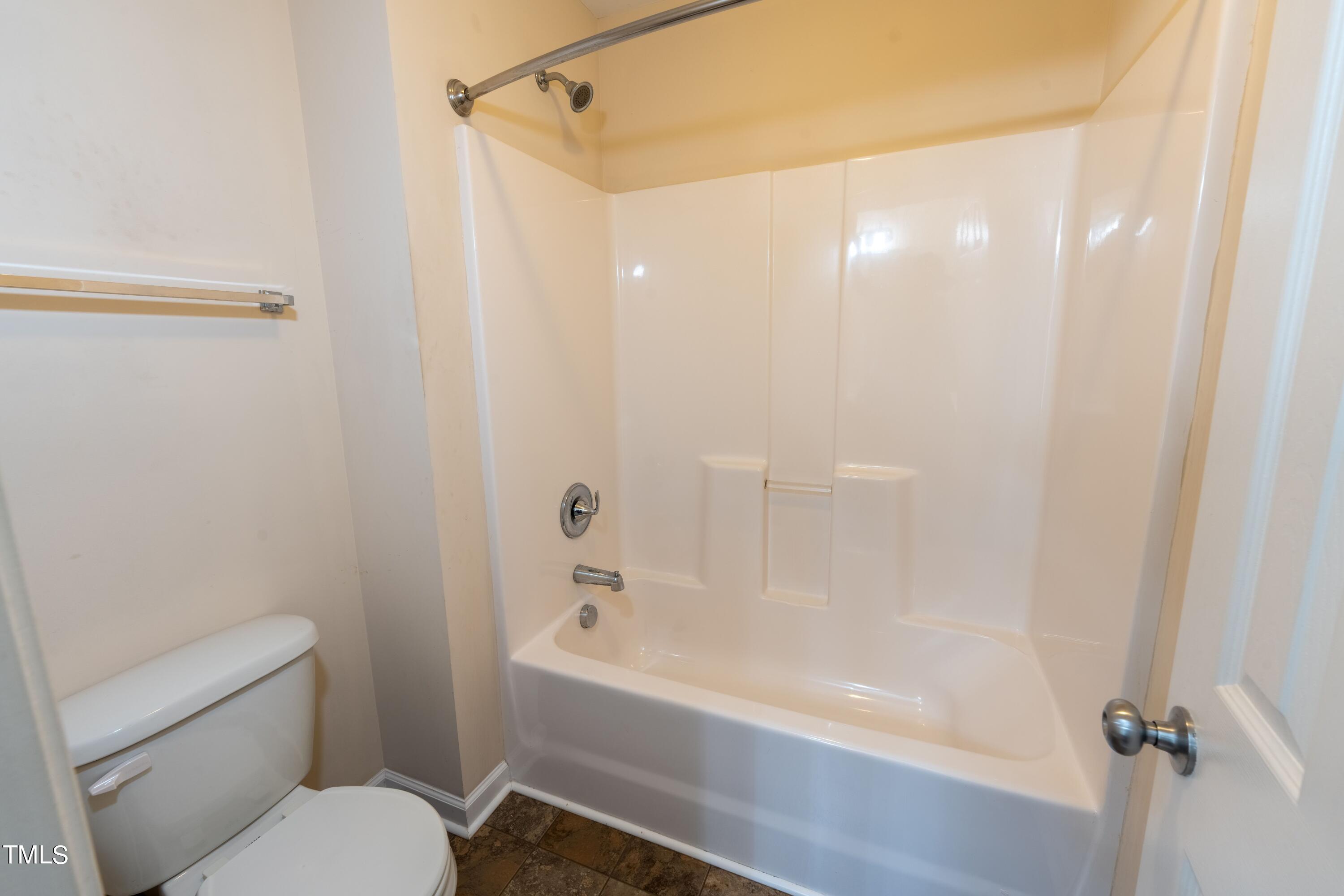 15 Lancaster Court Spring Lake, NC 28390 - Photo 42 of 48 a bathroom with a bathtub and a toilet