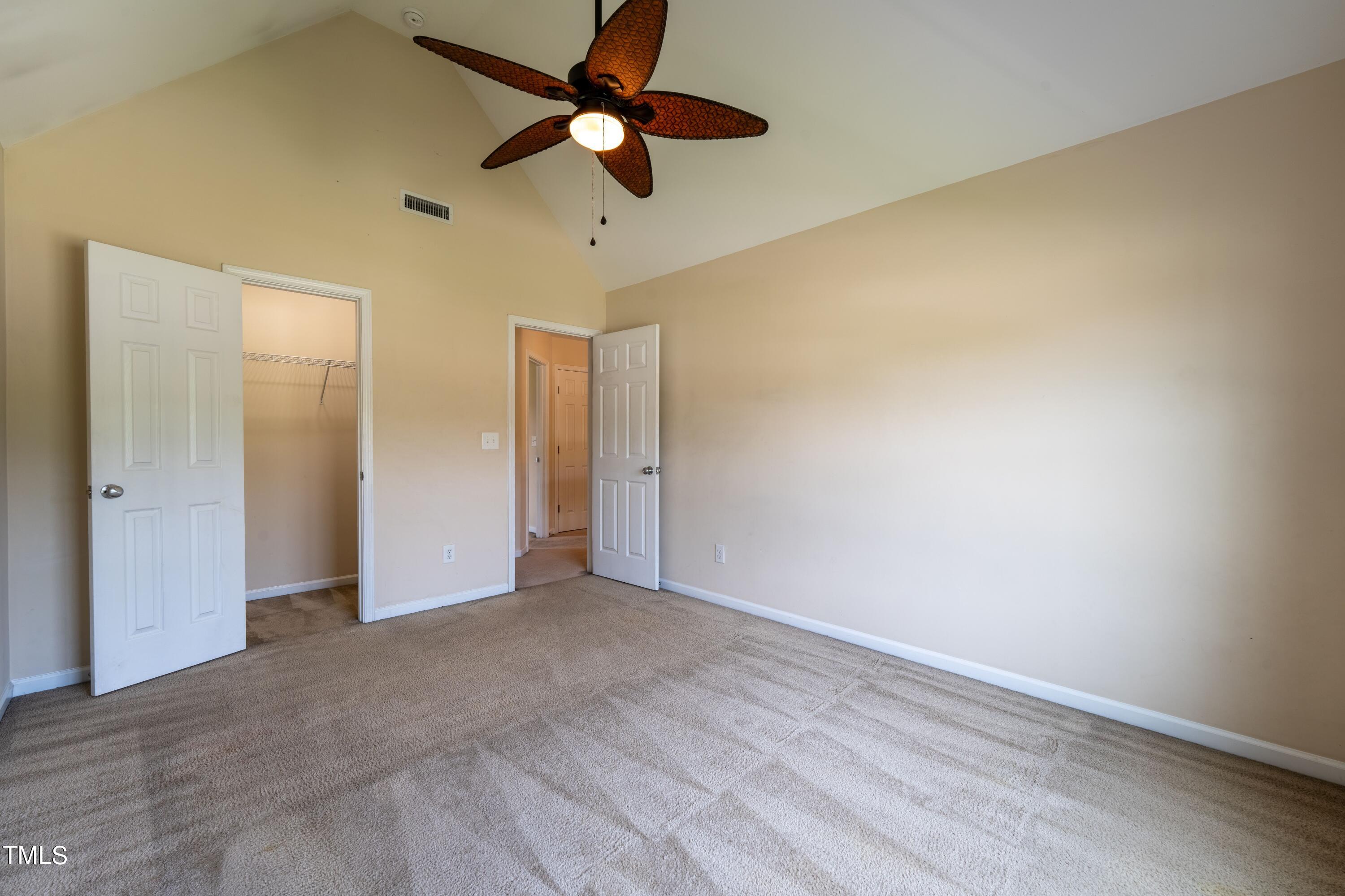 15 Lancaster Court Spring Lake, NC 28390 - Photo 48 of 48 an empty room with a ceiling fan and a window