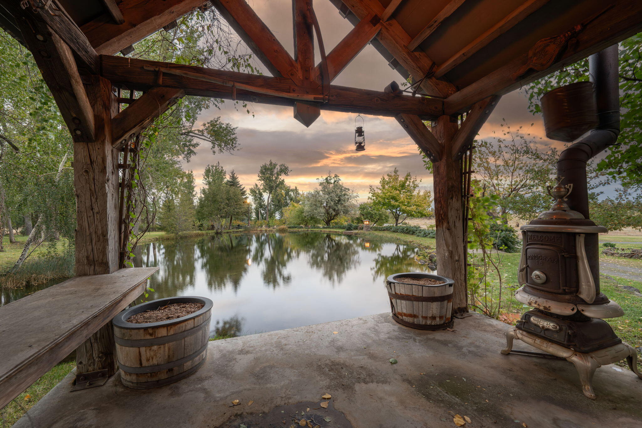 21925 Bear Creek Road Bend, OR 97702 - Photo 94 of 104 Gazebo and upper pond at sunset