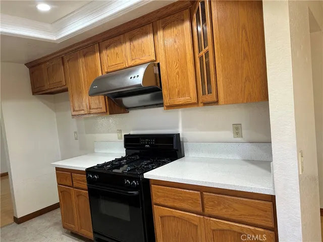 a kitchen with a stove and a microwave