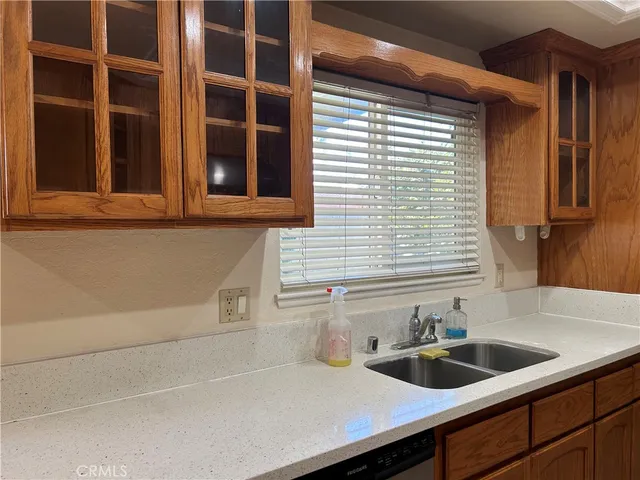 a kitchen with a sink and cabinets