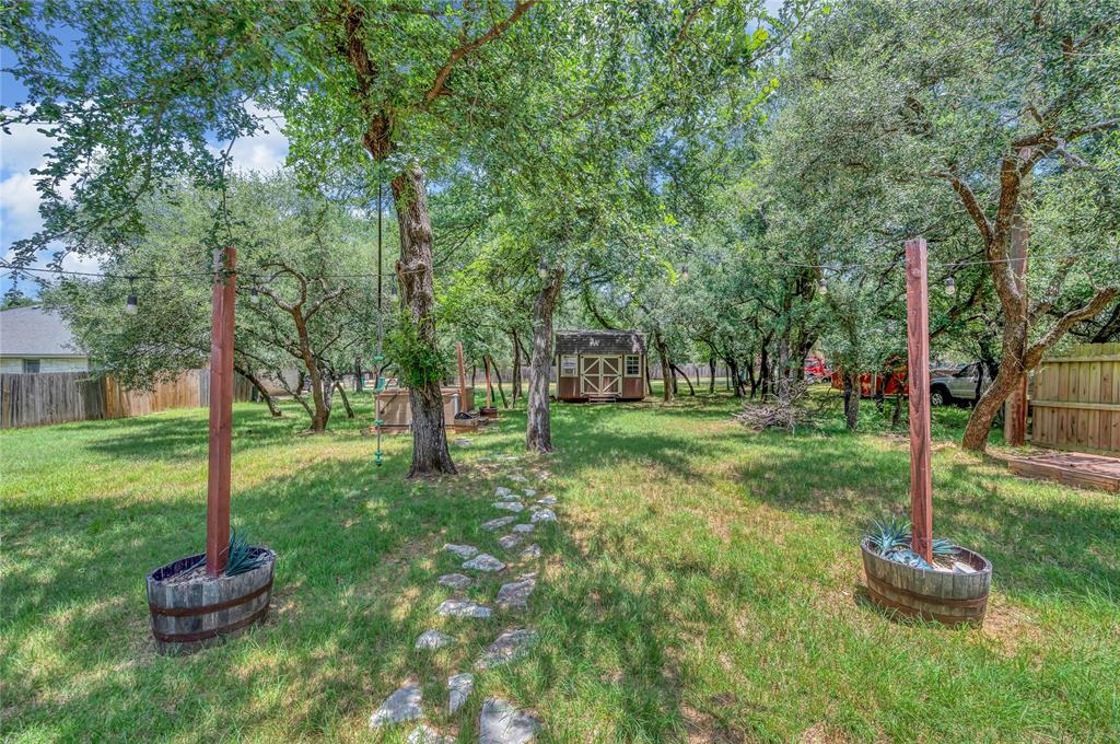 37 Bluebonnet Loop Morgan's Point Resort, TX 76513 - Photo 30 of 38 Expansive green space featuring mature trees providing ample shade