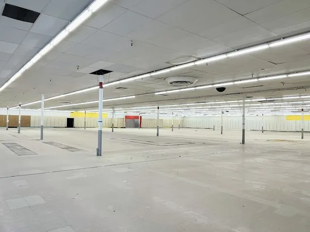 a bathroom with a shower and a sink
