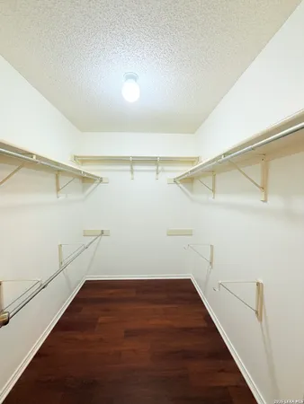 a view of a room with racks on the wall