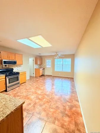 a view of a kitchen with a sink and cabinets