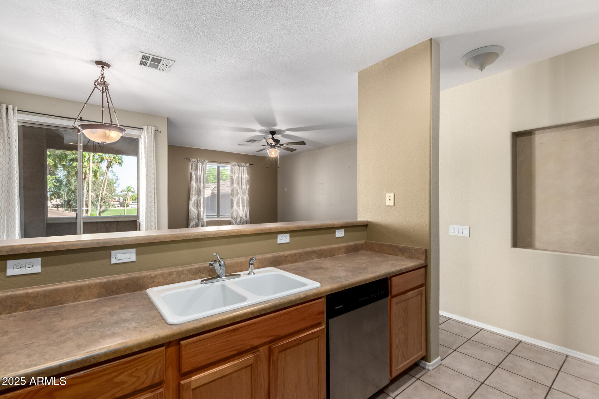 1335 East June Street, Unit 239 Mesa, AZ 85203 - Photo 12 of 34 a bathroom with a granite countertop sink and a window