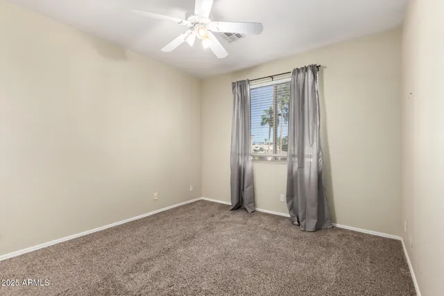 an empty room with a view of a bathroom