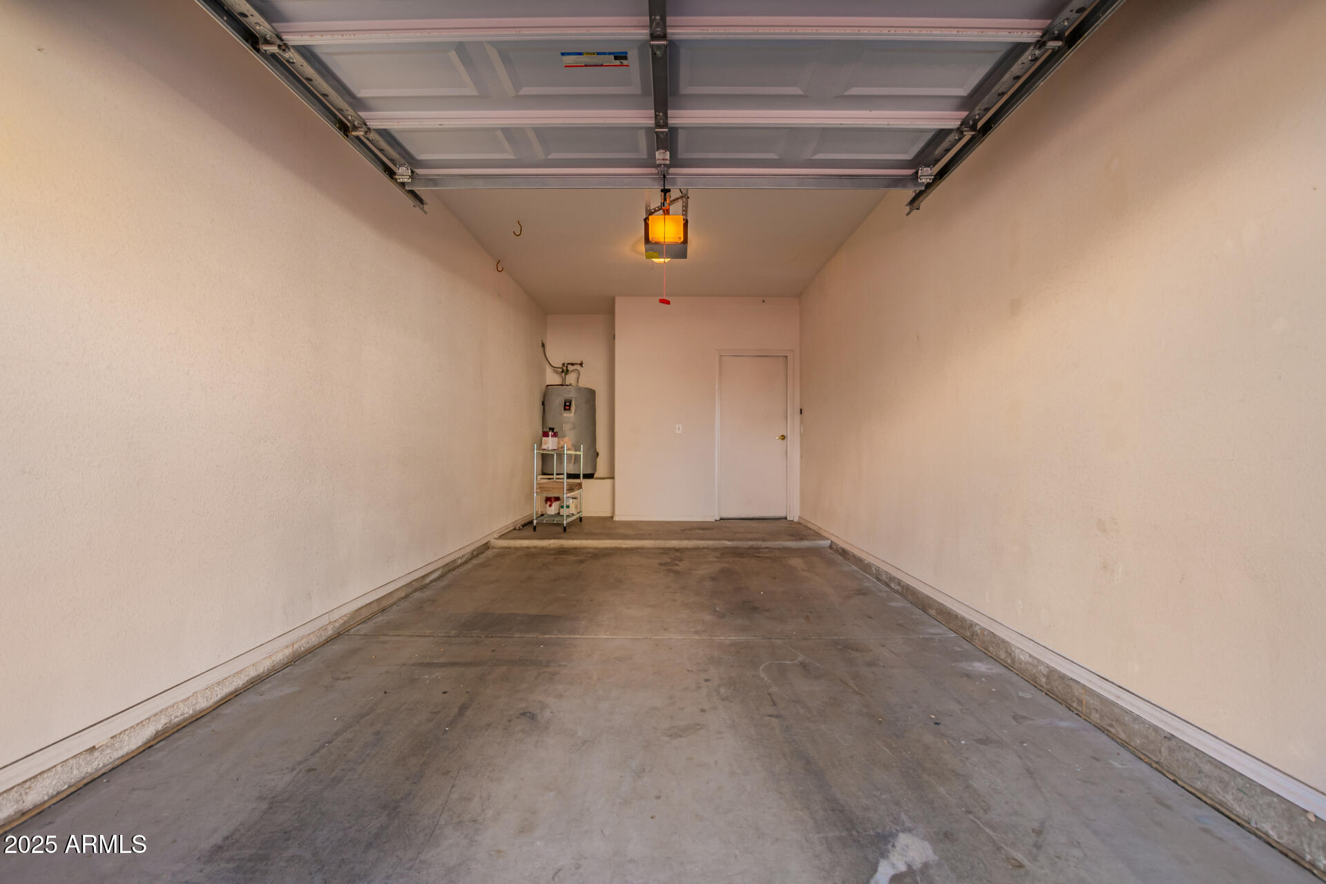 1335 East June Street, Unit 239 Mesa, AZ 85203 - Photo 25 of 34 a view of a garage with wooden floor