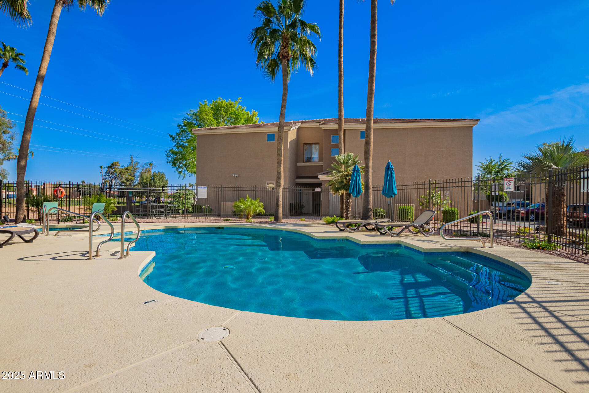 1335 East June Street, Unit 239 Mesa, AZ 85203 - Photo 26 of 34 a view of swimming pool with outdoor seating