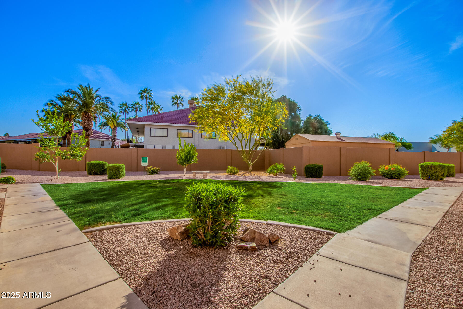1335 East June Street, Unit 239 Mesa, AZ 85203 - Photo 31 of 34 a front view of a house with garden
