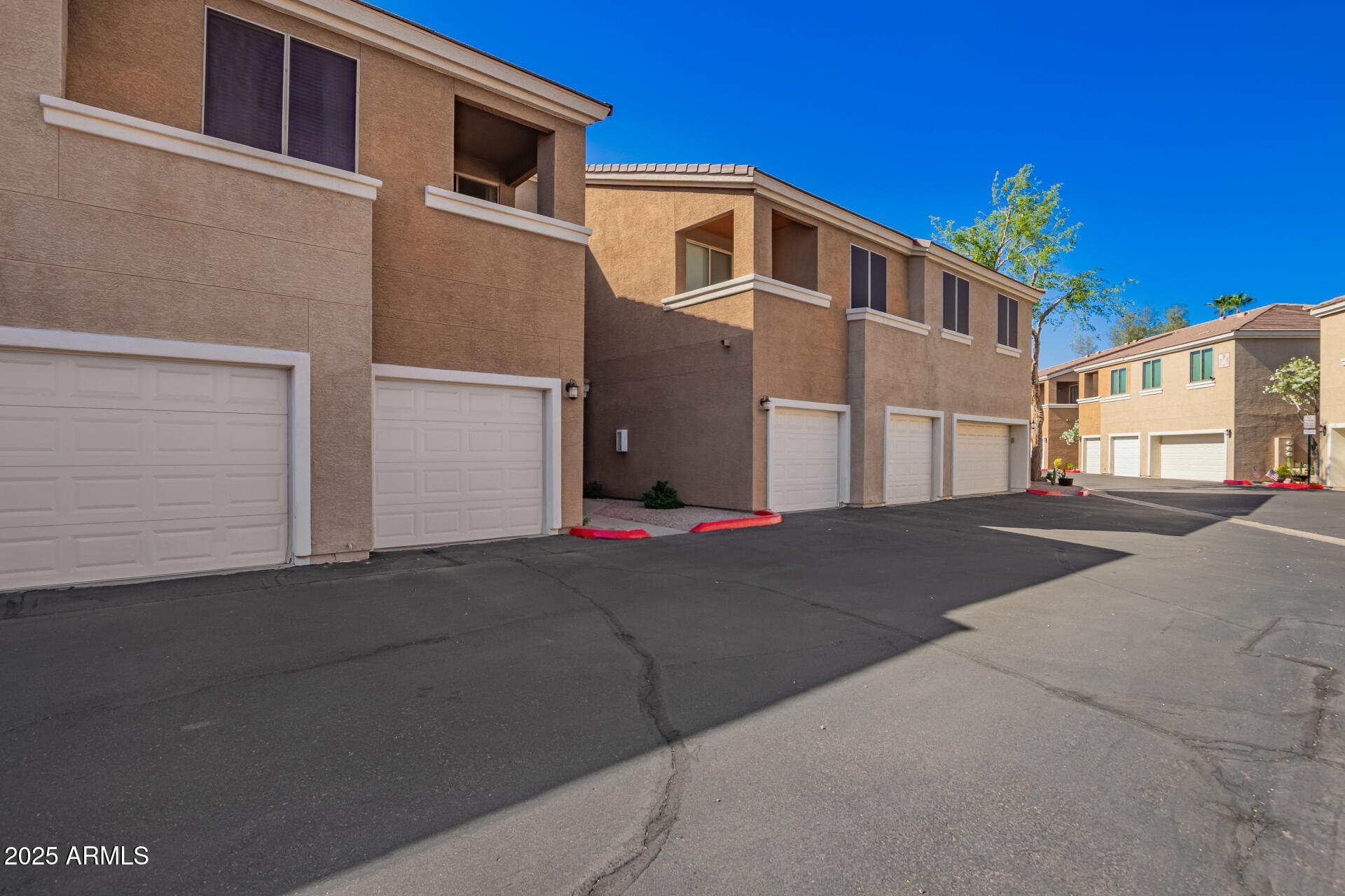 1335 East June Street, Unit 239 Mesa, AZ 85203 - Photo 34 of 34 a front view of a house with a yard