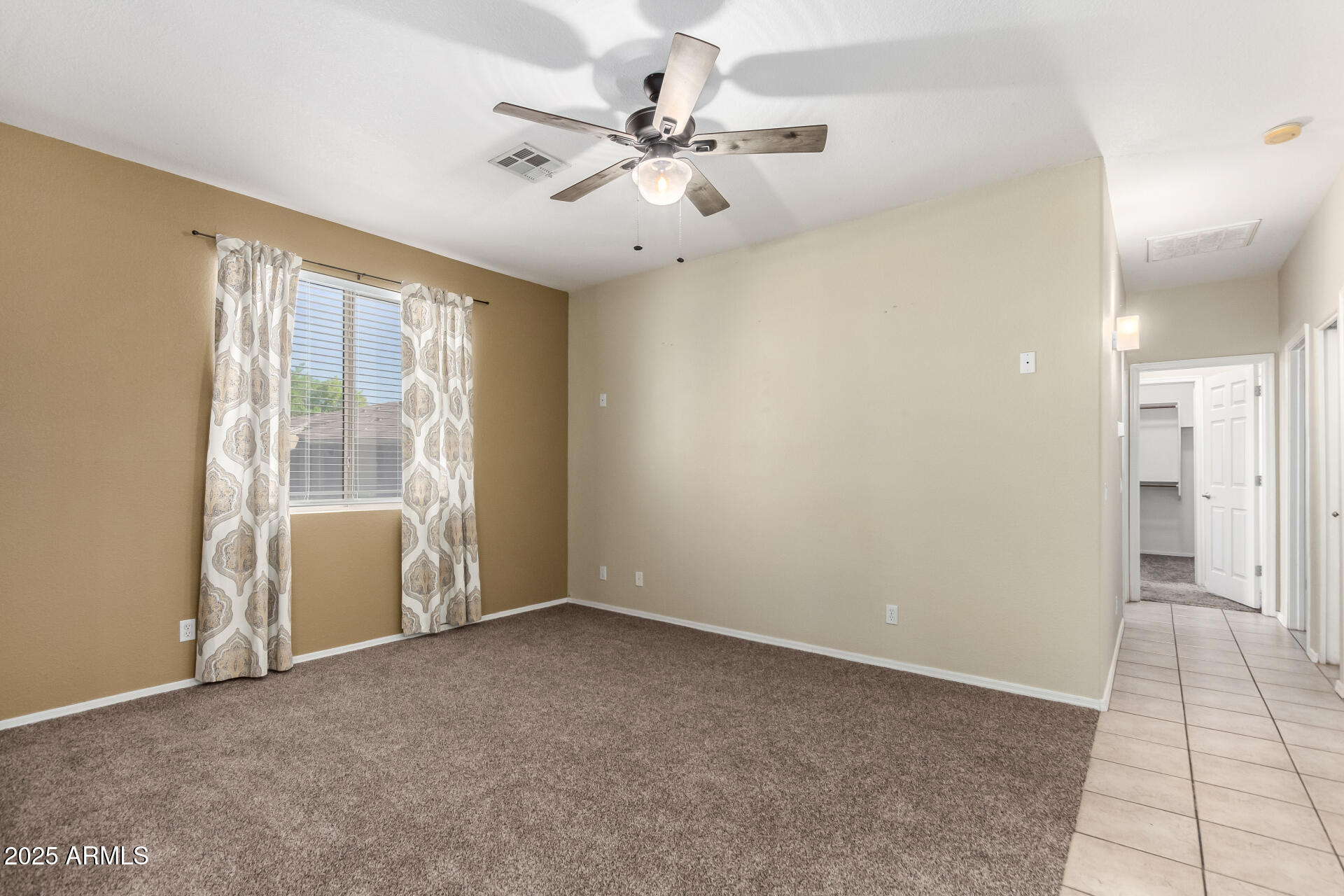 1335 East June Street, Unit 239 Mesa, AZ 85203 - Photo 8 of 34 a view of an empty room with a window