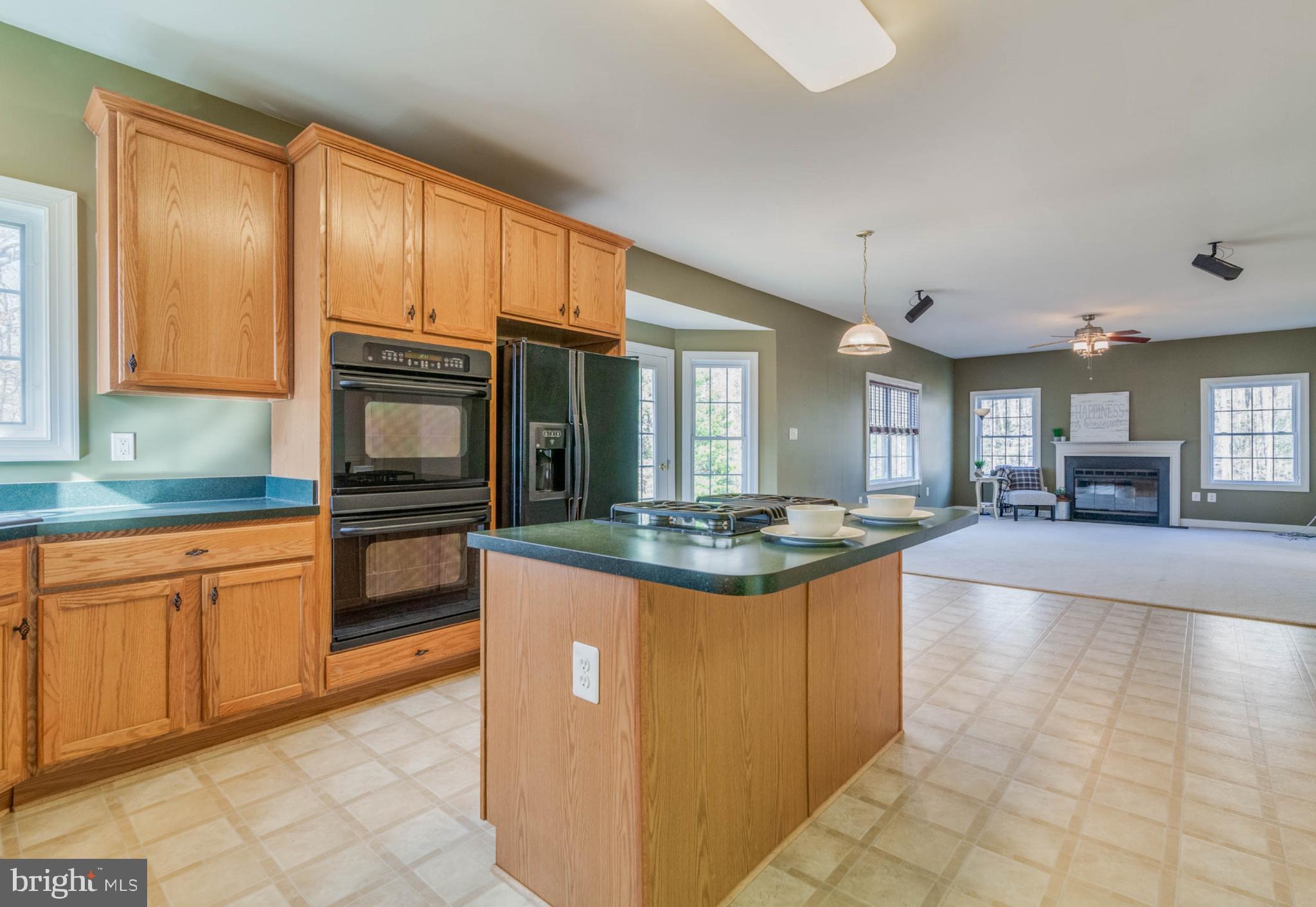 14420 Crawleys Dam Road Goldvein, VA 22720 - Photo 6 of 29 Kitchen island for cooking and casual dining