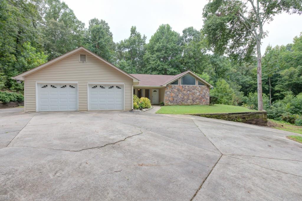 9650 Cedar Grove Road Chattahoochee Hills, GA 30213 - Photo 1 of 1 a view of a house with a yard and large trees