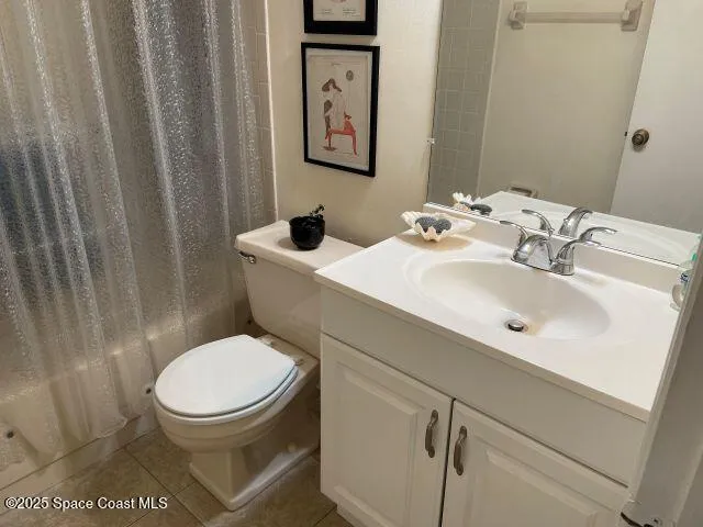 a bathroom with a toilet a sink and a mirror