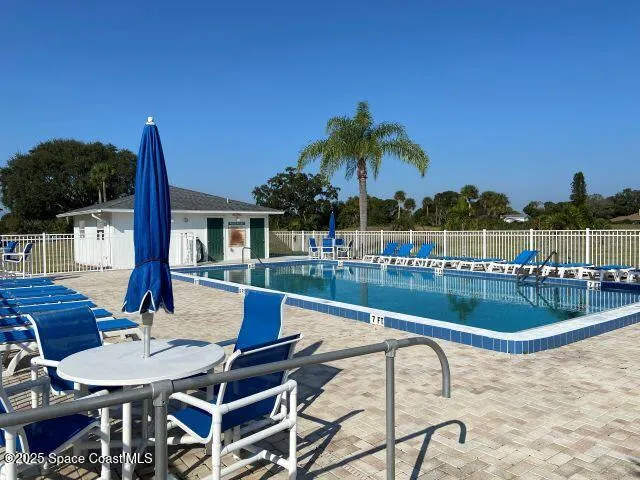 a view of a patio with swimming pool