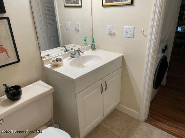 a bathroom with a sink toilet and vanity
