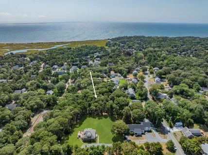 an aerial view of a houses with a yard