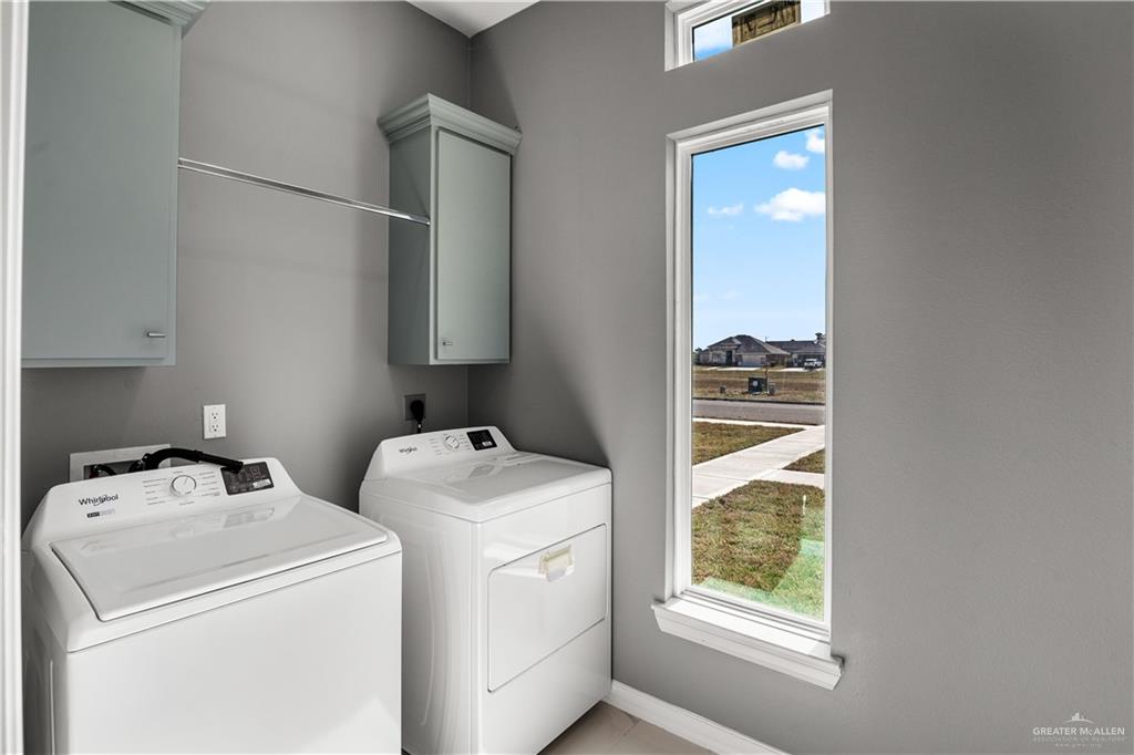 1402 Tee Box Drive Weslaco, TX 78596 - Photo 15 of 20 a utility room with dryer and washer