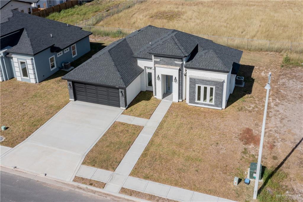 1402 Tee Box Drive Weslaco, TX 78596 - Photo 20 of 20 a view of a house with wooden fence