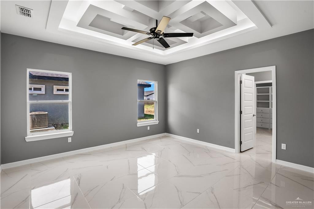 1402 Tee Box Drive Weslaco, TX 78596 - Photo 8 of 20 a view of a livingroom with a ceiling fan and window
