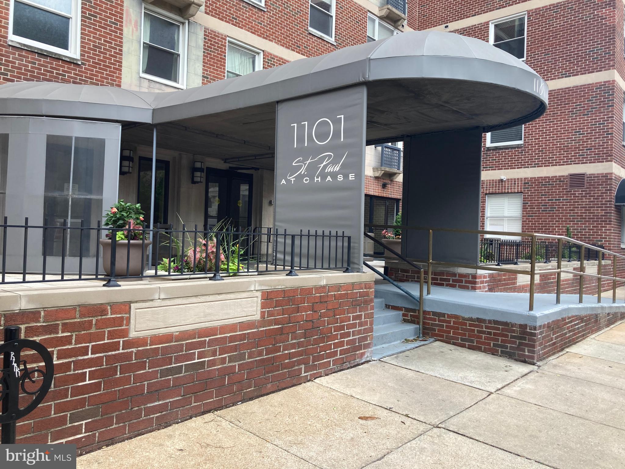 a view of a building with a potted plant