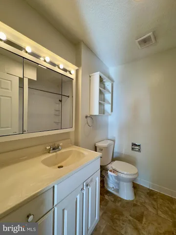 a bathroom with a sink and a toilet