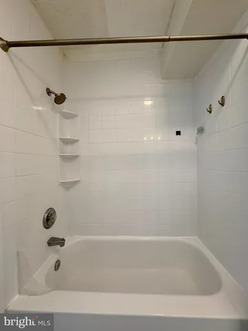 a bathroom with a shower and a bathtub