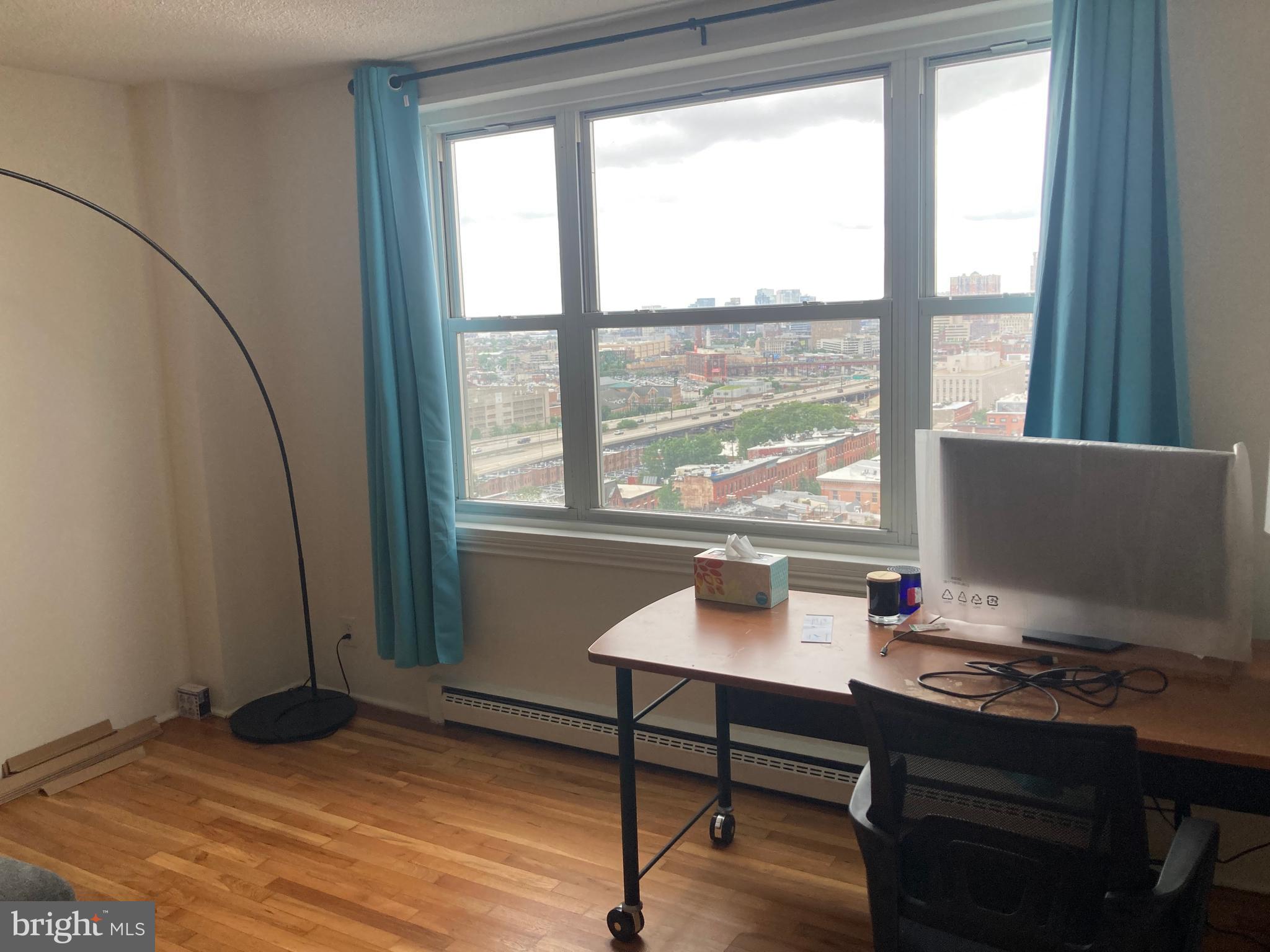 1101 St Paul Street, Unit 1403 Baltimore, MD 21202 - Photo 10 of 13 a workspace with furniture and window