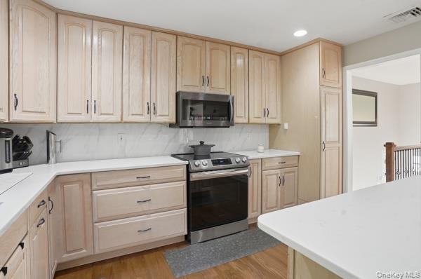 31 Laura Road Monroe, NY 10950 - Photo 12 of 39 a kitchen with granite countertop white cabinets and stainless steel appliances