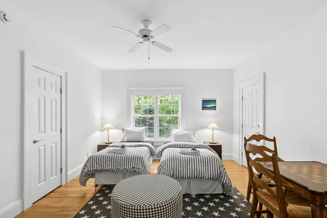 a bedroom with furniture and a window