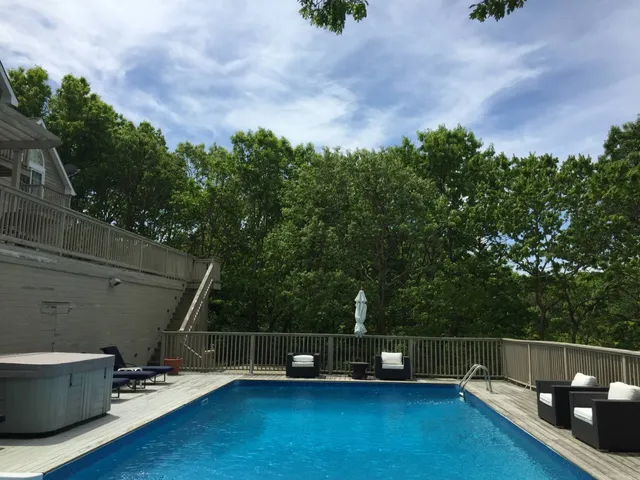a view of a backyard with sitting area