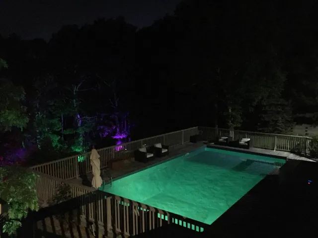 a view of a balcony with two chairs and a potted plant